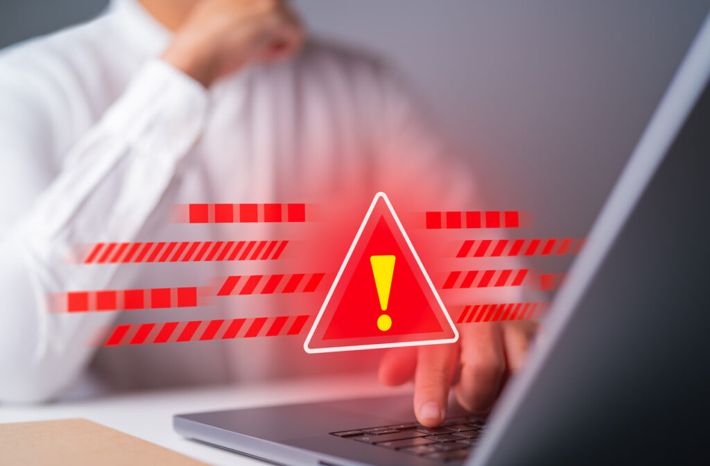 System-warning-triangle-sign-caution-for-error-notification-and-maintenance-concept-Cybersecurity-vulnerability-network-weaknesses-illegal-compromised-connection-cyber-threat-attack-on-computer