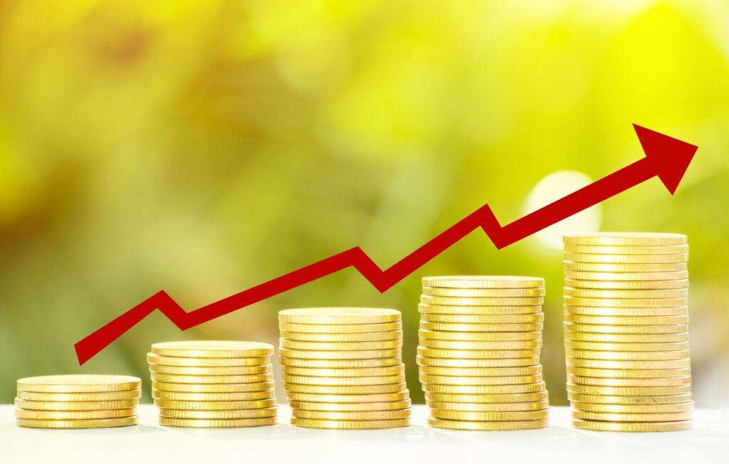 Collect-of-golden-coins-with-fresh-tree-growth-and-bokeh-background