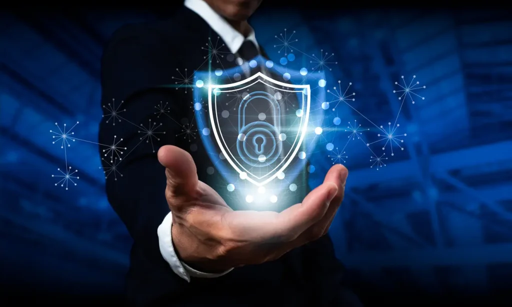 Businessman-holding-a-shield-with-a-padlock-on-a-worldwide-networking-connection-Data-protection-and-network-security-insurance-company-internet-fire-wall-and-criminal-cyber-protection