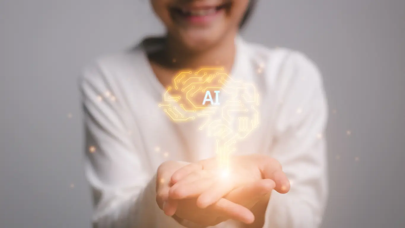 AI-technology-concept-on-virtual-screen-girl-hands-holding-the-brain-innovative-technology-in-science-and-communication-concept