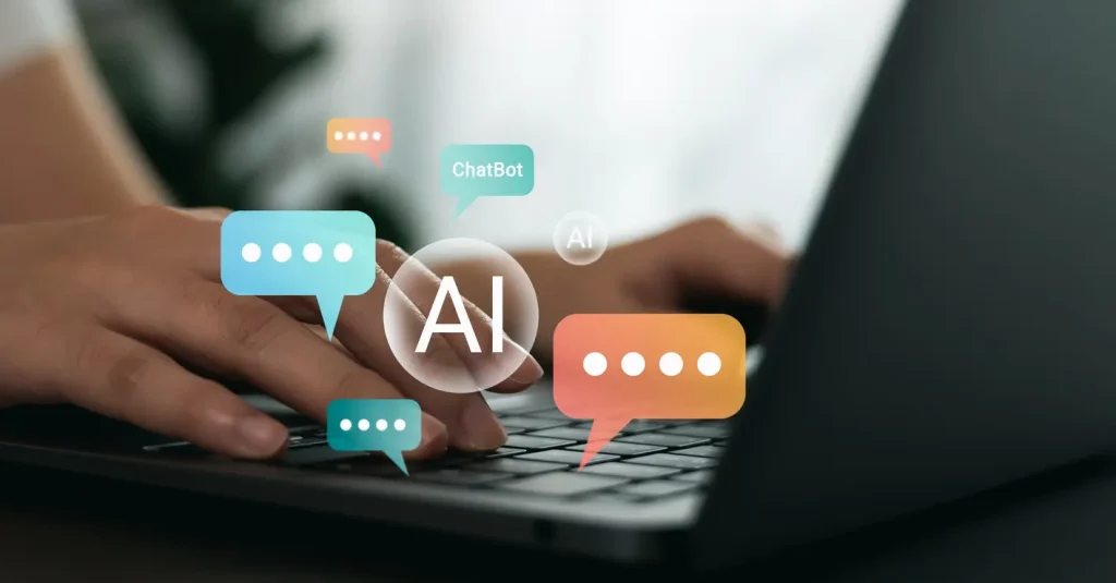 Hand-using-laptop-and-chatting-with-chatbot-application-shows-message-speech-bubbles-digital-screen-of-social-media-notifications-Ai-Artificial-Intelligence-technology-concept