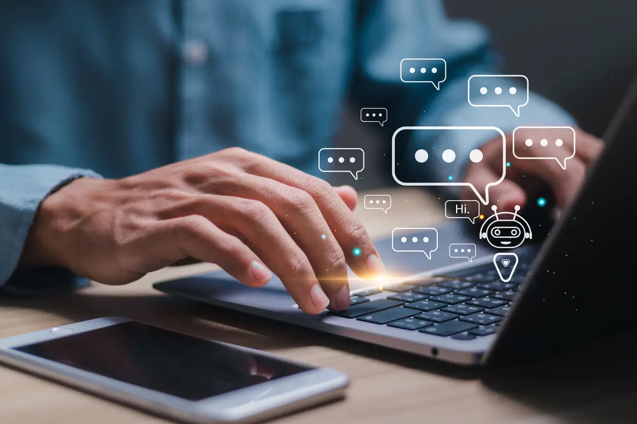 AI-technology-Businessman-use-laptop-with-virtual-screen-of-AI-chatbot-communicate-and-answer-questions-Artificial-intelligence-solves-problems-and-assists-human-decision-making-for-users