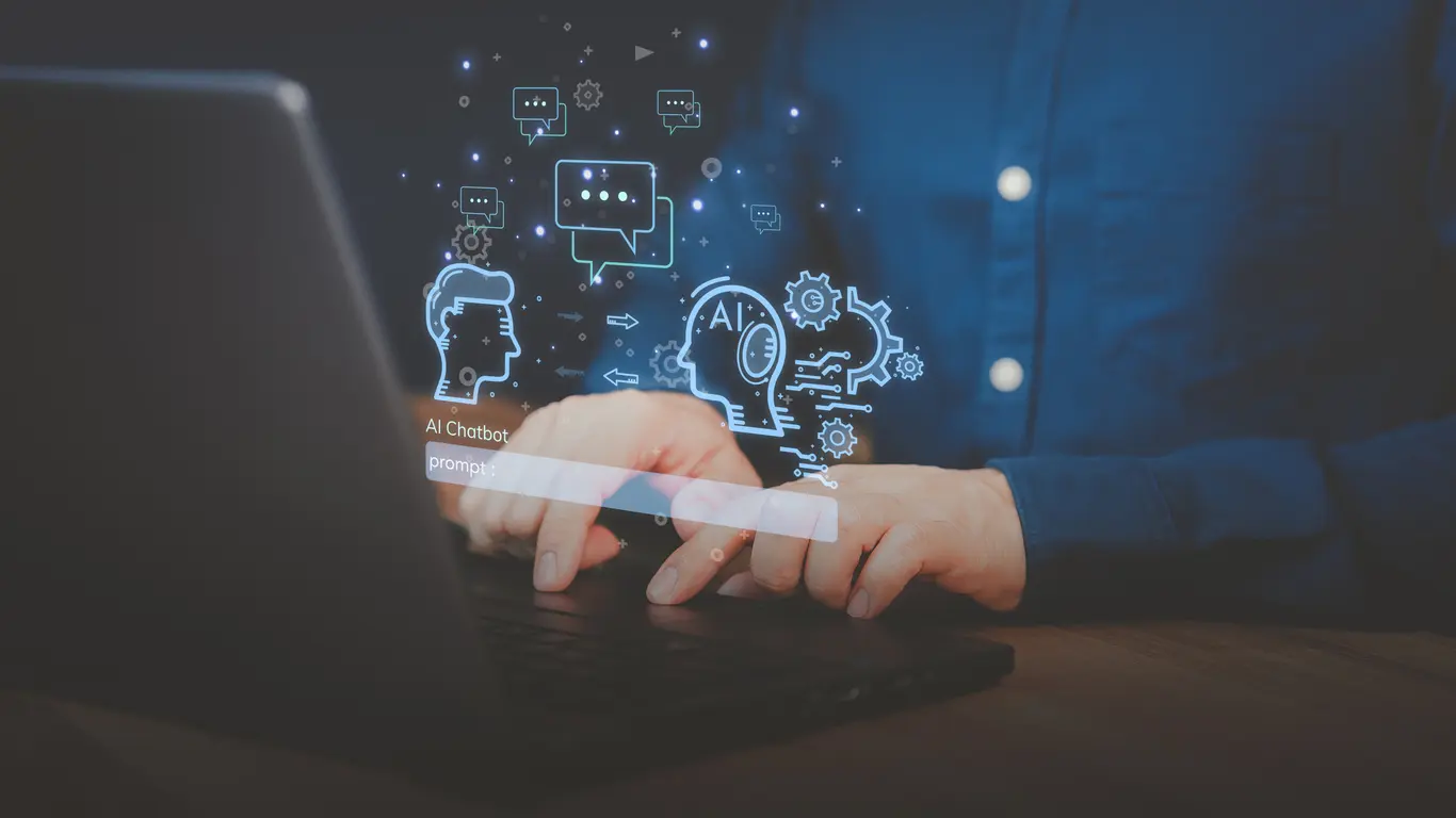 Adult-man-using-a-laptop-computer-chatting-with-chat-bot-Chat-with-smart-AI-or-Artificial-Intelligence-technology-Futuristic-technology-transformation-Chatbot-ai-communication